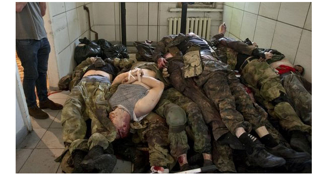 Mortos em combate em Donetsk, Ucrânia. Foto em www.lavanguardia.com/index.html